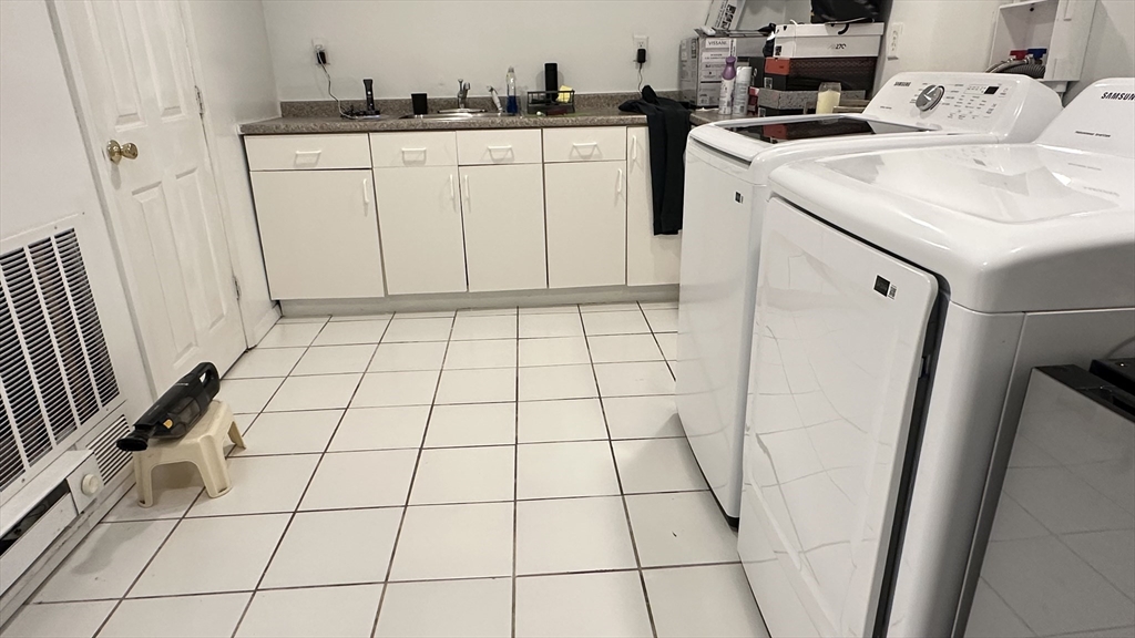 46-48 Buckley Street Quincy, MA 02169 - Photo 24 of 42 a utility room with dryer and washer