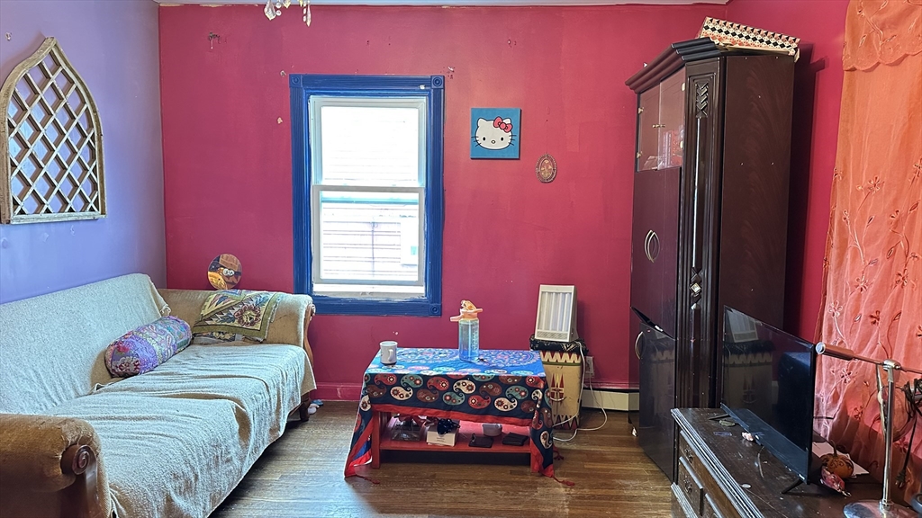 46-48 Buckley Street Quincy, MA 02169 - Photo 28 of 42 a bedroom with a bed and a window