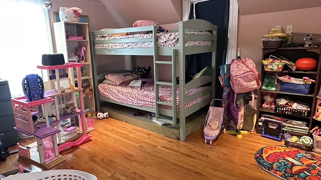 46-48 Buckley Street Quincy, MA 02169 - Photo 36 of 42 a living room with furniture and a wooden floor