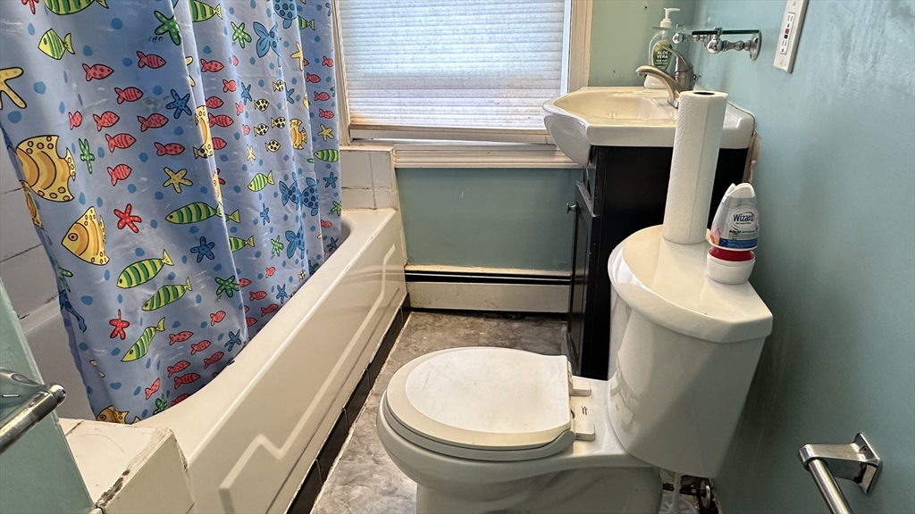 46-48 Buckley Street Quincy, MA 02169 - Photo 37 of 42 a bathroom with a sink and mirror with toilet