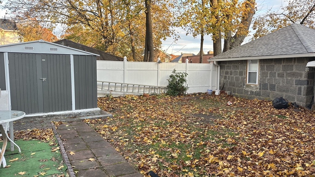 46-48 Buckley Street Quincy, MA 02169 - Photo 41 of 42 a front view of a house with a yard