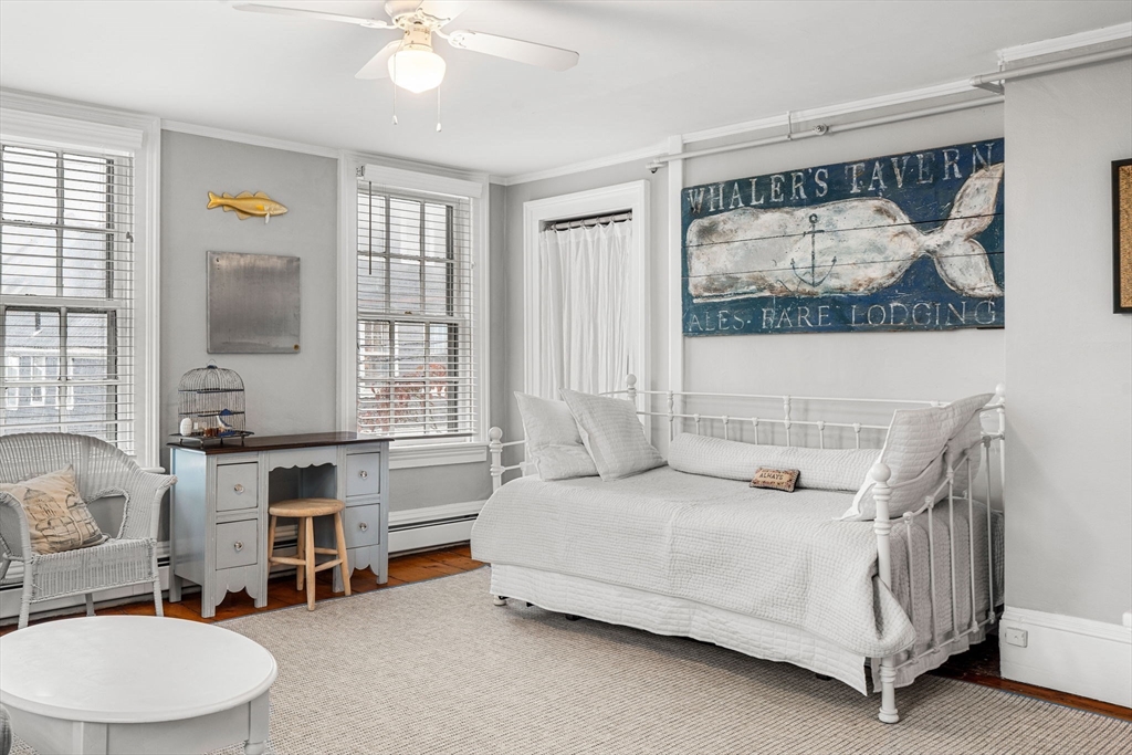 45 Washington Street, Unit 3 Marblehead, MA 01945 - Photo 11 of 24 a spacious bedroom with a bed a couch and large window