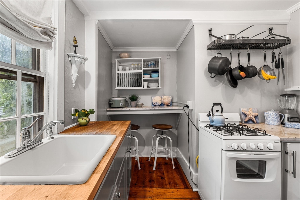 45 Washington Street, Unit 3 Marblehead, MA 01945 - Photo 16 of 24 a kitchen with a stove and a sink