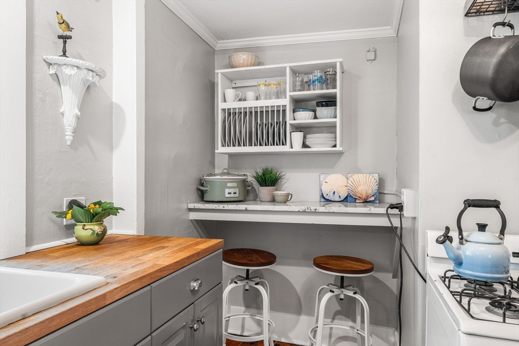 45 Washington Street, Unit 3 Marblehead, MA 01945 - Photo 17 of 24 a dining room with granite countertop furniture