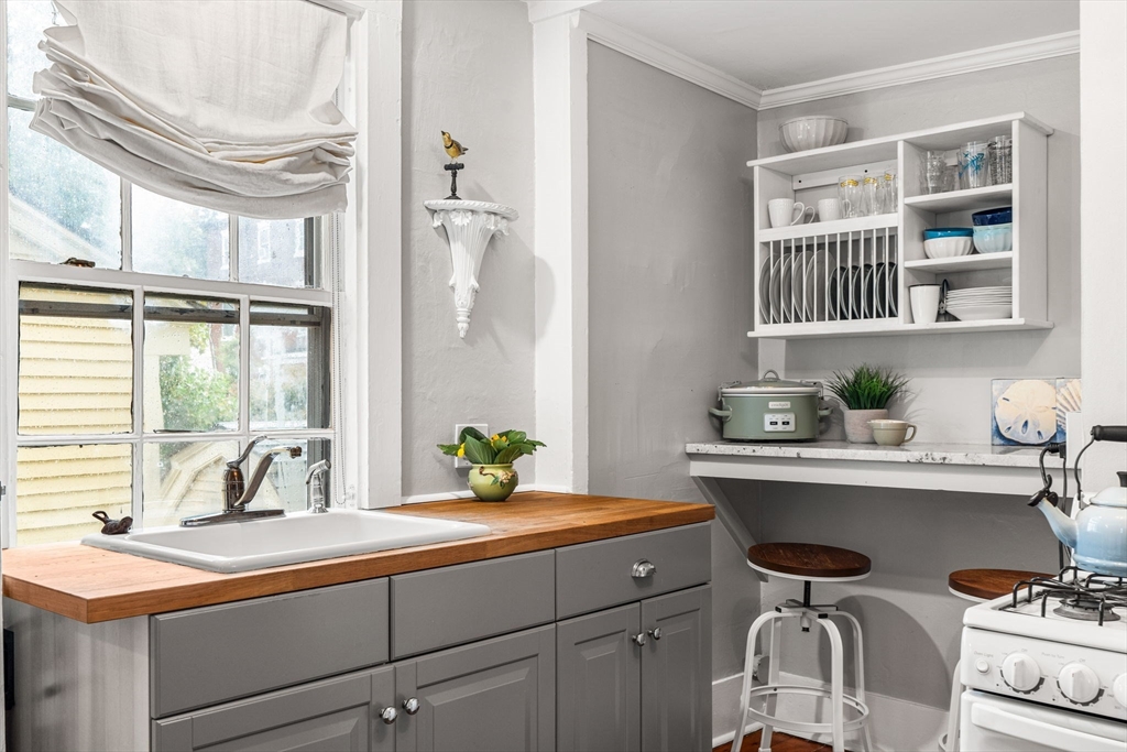 45 Washington Street, Unit 3 Marblehead, MA 01945 - Photo 18 of 24 a kitchen with a sink cabinets and window