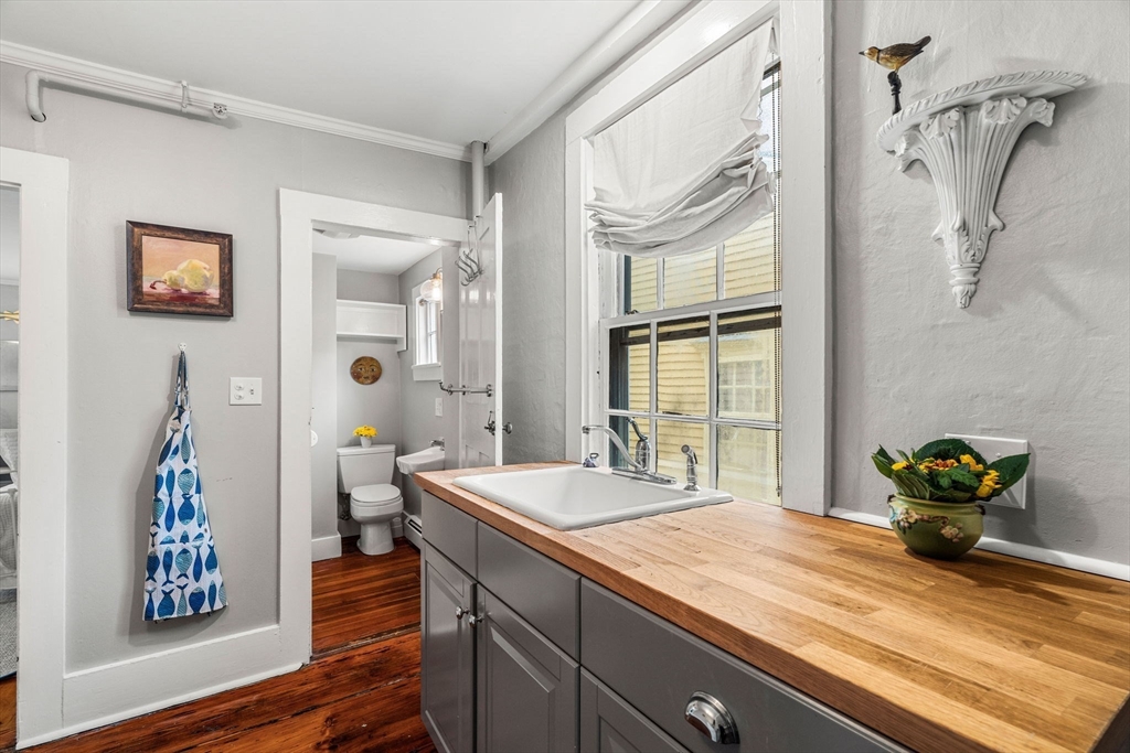 45 Washington Street, Unit 3 Marblehead, MA 01945 - Photo 20 of 24 a bath room with a sink and a mirror