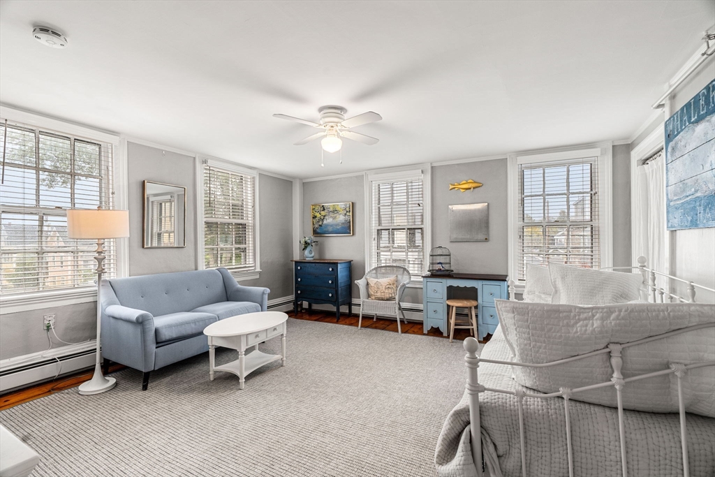 45 Washington Street, Unit 3 Marblehead, MA 01945 - Photo 7 of 24 a living room with furniture and a large window