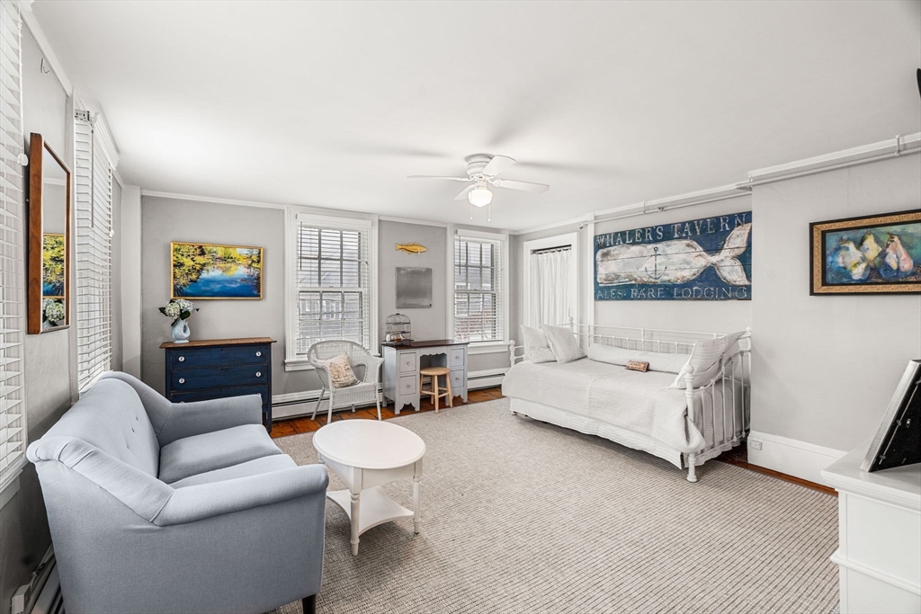 45 Washington Street, Unit 3 Marblehead, MA 01945 - Photo 9 of 24 a living room with furniture and a large window