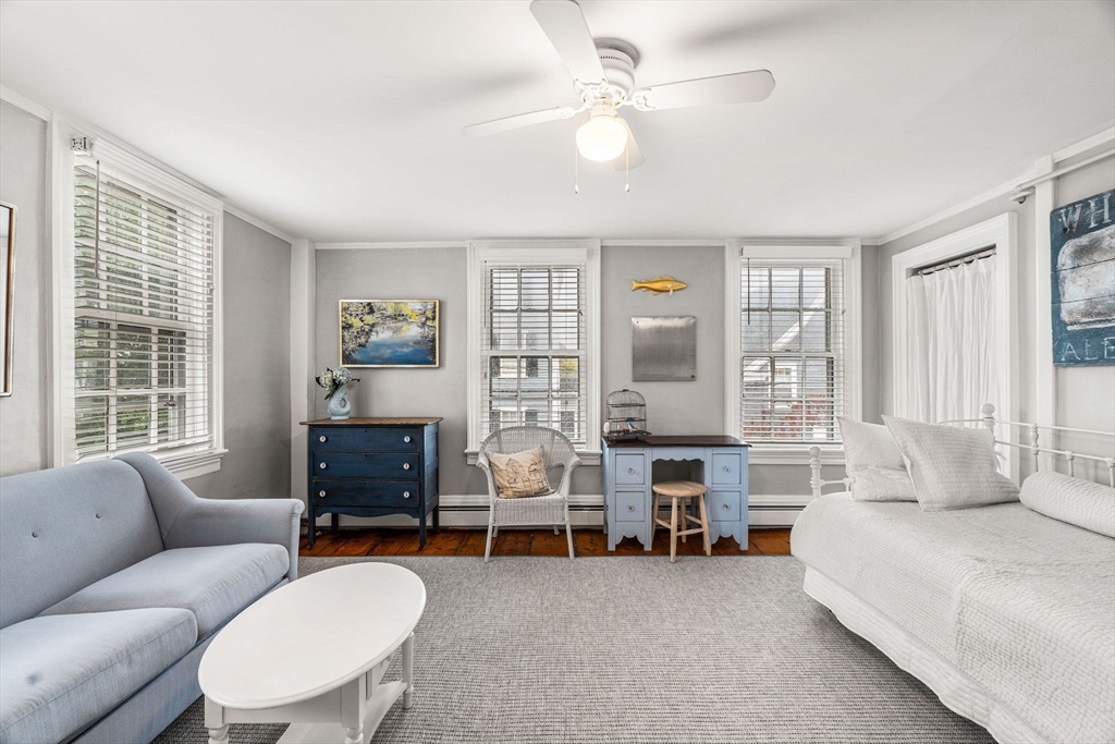 45 Washington Street, Unit 3 Marblehead, MA 01945 - Photo 10 of 24 a living room with furniture a fireplace and a window