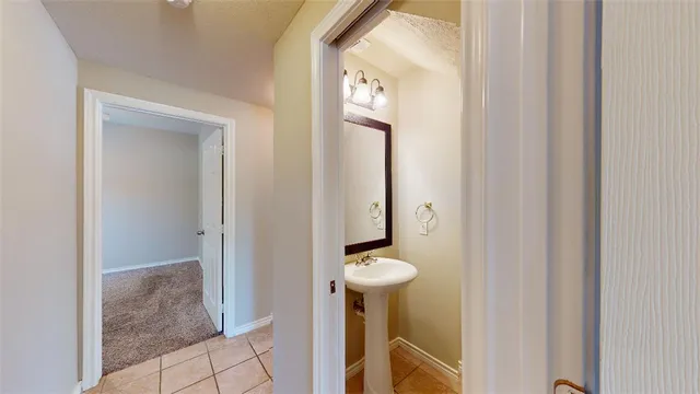 a bathroom with a shower and mirror