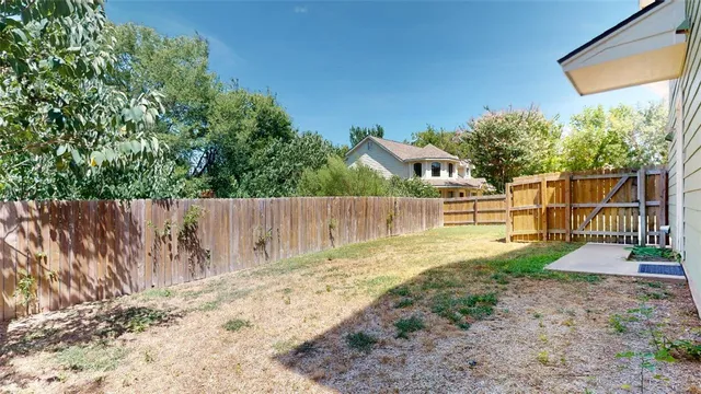 a view of a backyard with a house