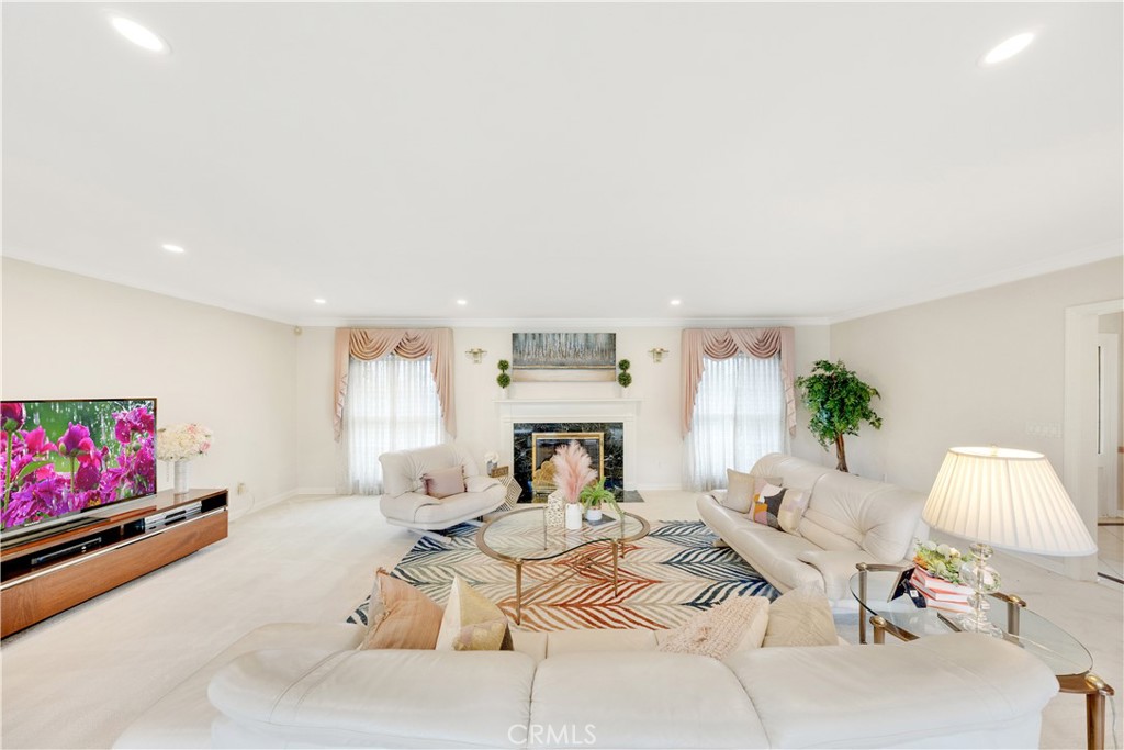 2835 Devonport Road San Marino, CA 91108 - Photo 7 of 54 a living room with furniture and a fireplace