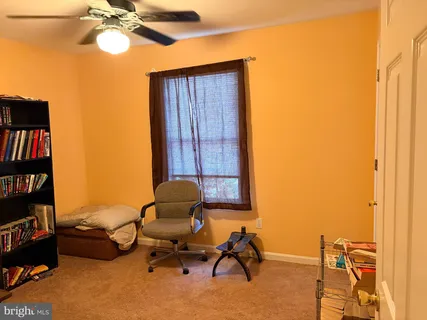 a view of workspace with lounge chair