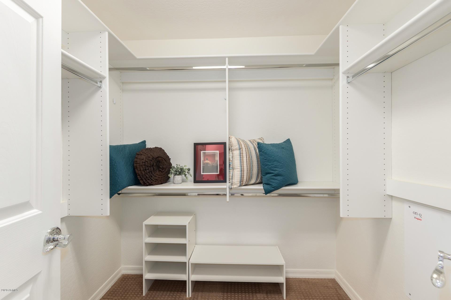 3935 East Rough Rider Road, Unit 1131 Phoenix, AZ 85050 - Photo 17 of 30 Master Walk-in Closet