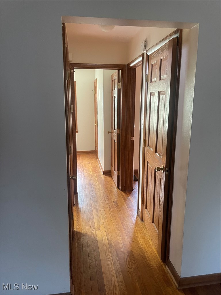 1881 17th Street Southwest Akron, OH 44314 - Photo 6 of 20 View from front door.Corridor with light wood finished floors and baseboards