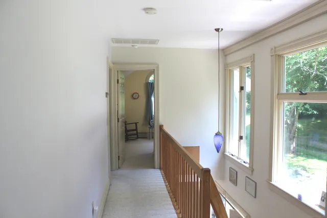 a wooden bench sitting in the middle of a yard