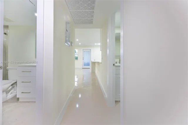 a spacious bathroom with a sink a mirror and a shower