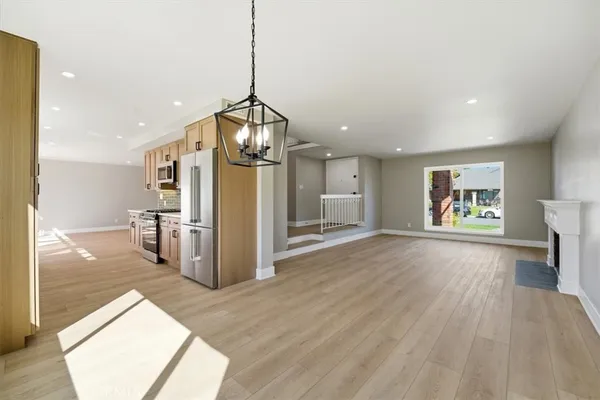 a kitchen with stainless steel appliances granite countertop a stove and a sink