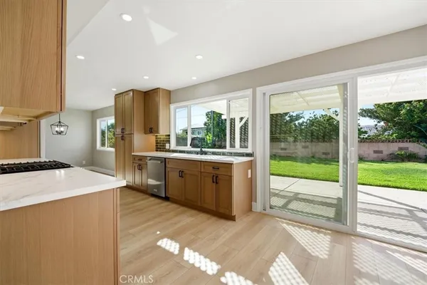 a view of an empty room with a sink and a floor to ceiling window