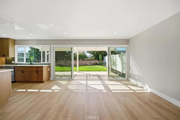 a living room with a floor to ceiling window and floor to ceiling window