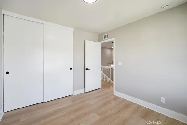a bathroom with a toilet a sink a bathtub and a mirror
