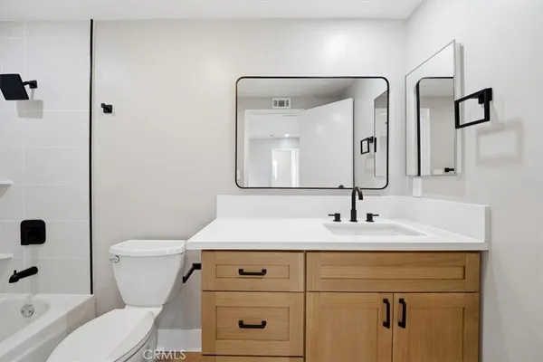 a bed room with a bed and a large window