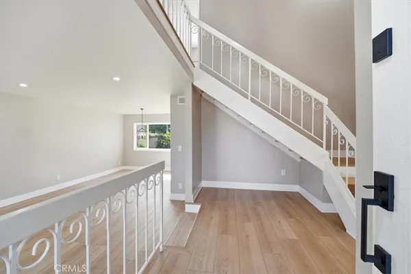 a view of entryway with wooden floor