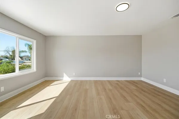 a spacious bathroom with a double vanity sink mirror and toilet