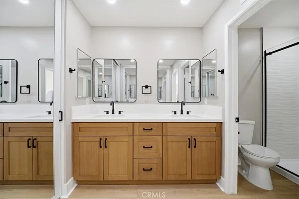 a bathroom with a sink a mirror and a shower