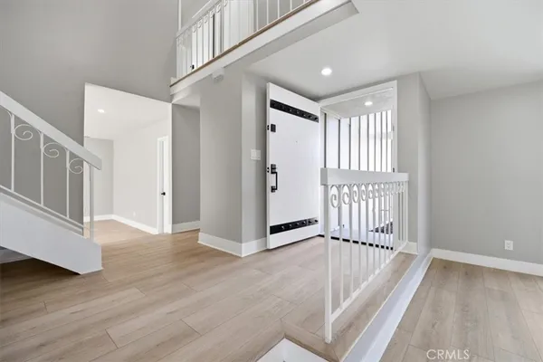a view of an entryway with wooden floor