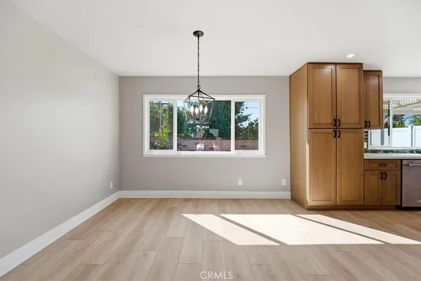 a view of a kitchen with a refrigerator ceiling fan and window