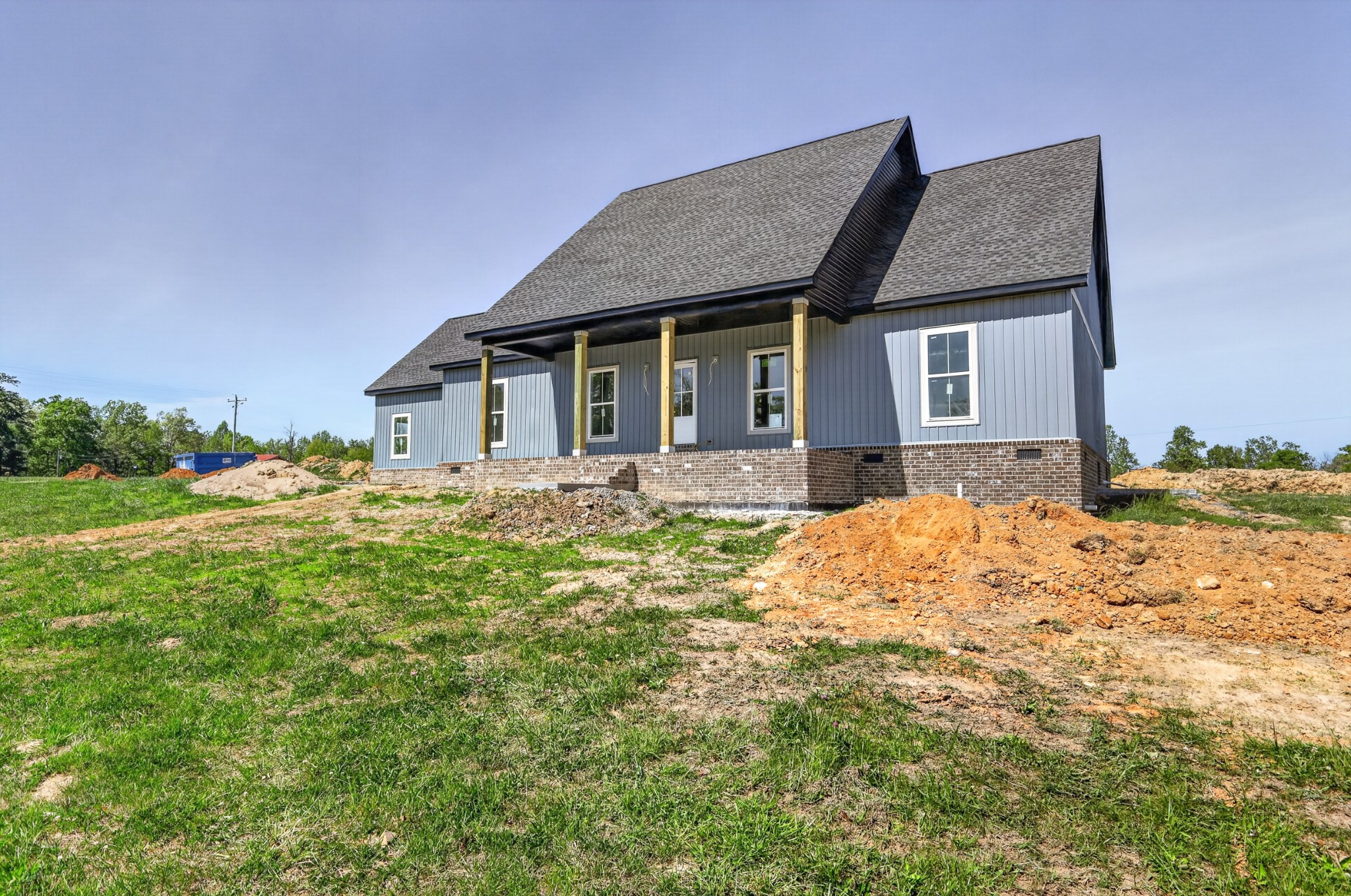 515 Powell Hollow Road Tullahoma, TN 37388 - Photo 4 of 27 a front view of a house with a yard and potted plants