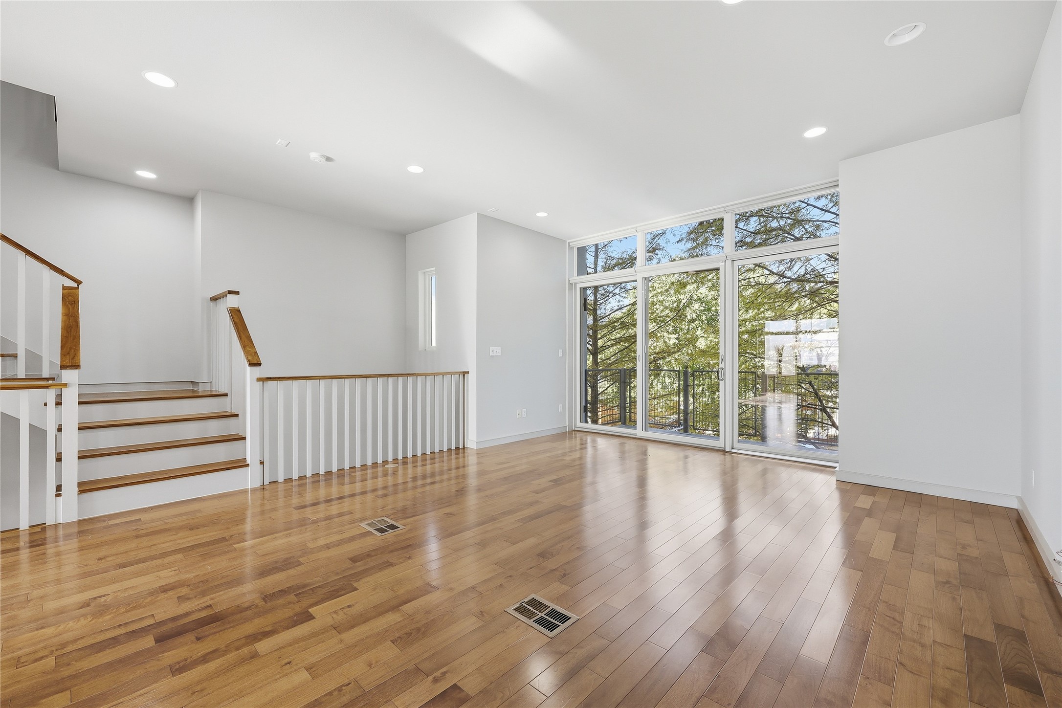 3507 Harmon Avenue Austin, TX 78705 - Photo 15 of 36 a view of an empty room with wooden floor and a window