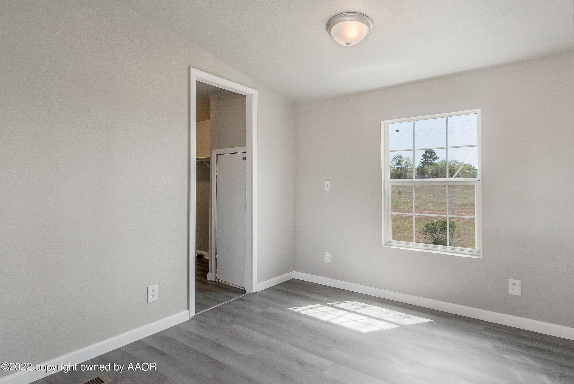 3501 Silver Hill Circle Amarillo, TX 79108 - Photo 12 of 25 an empty room with windows and closet