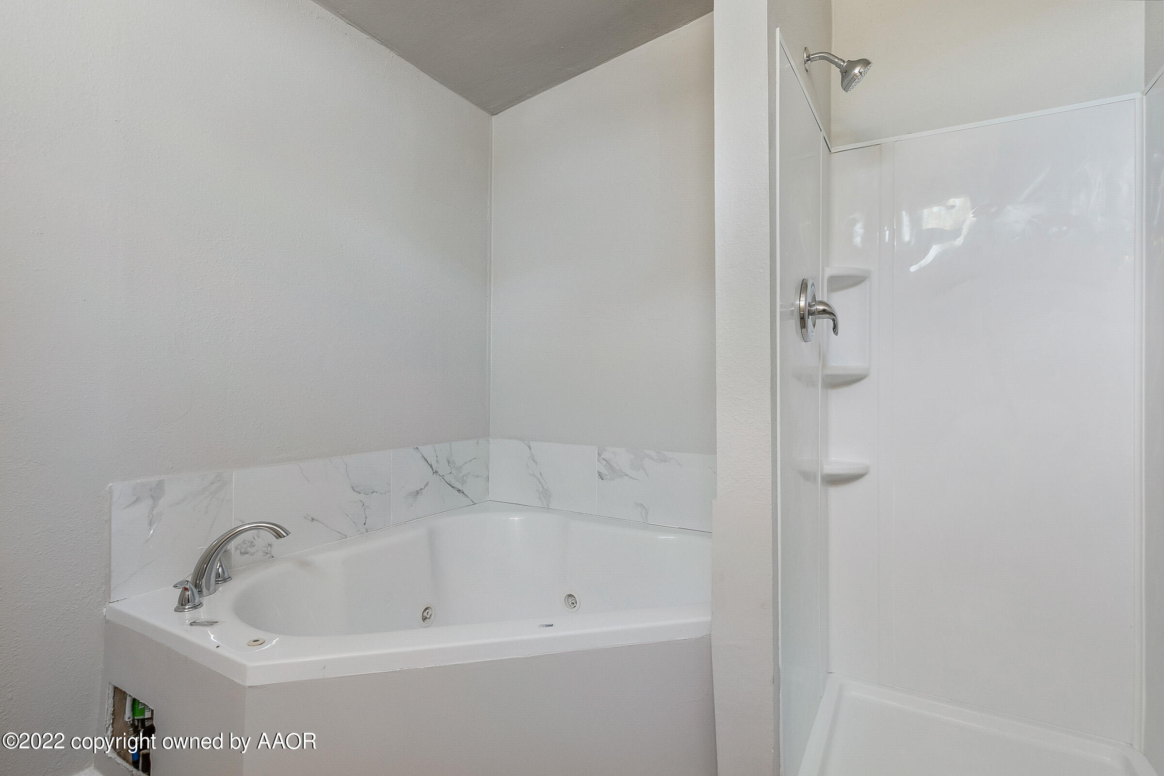 3501 Silver Hill Circle Amarillo, TX 79108 - Photo 16 of 25 a white bath tub sitting next to a shower