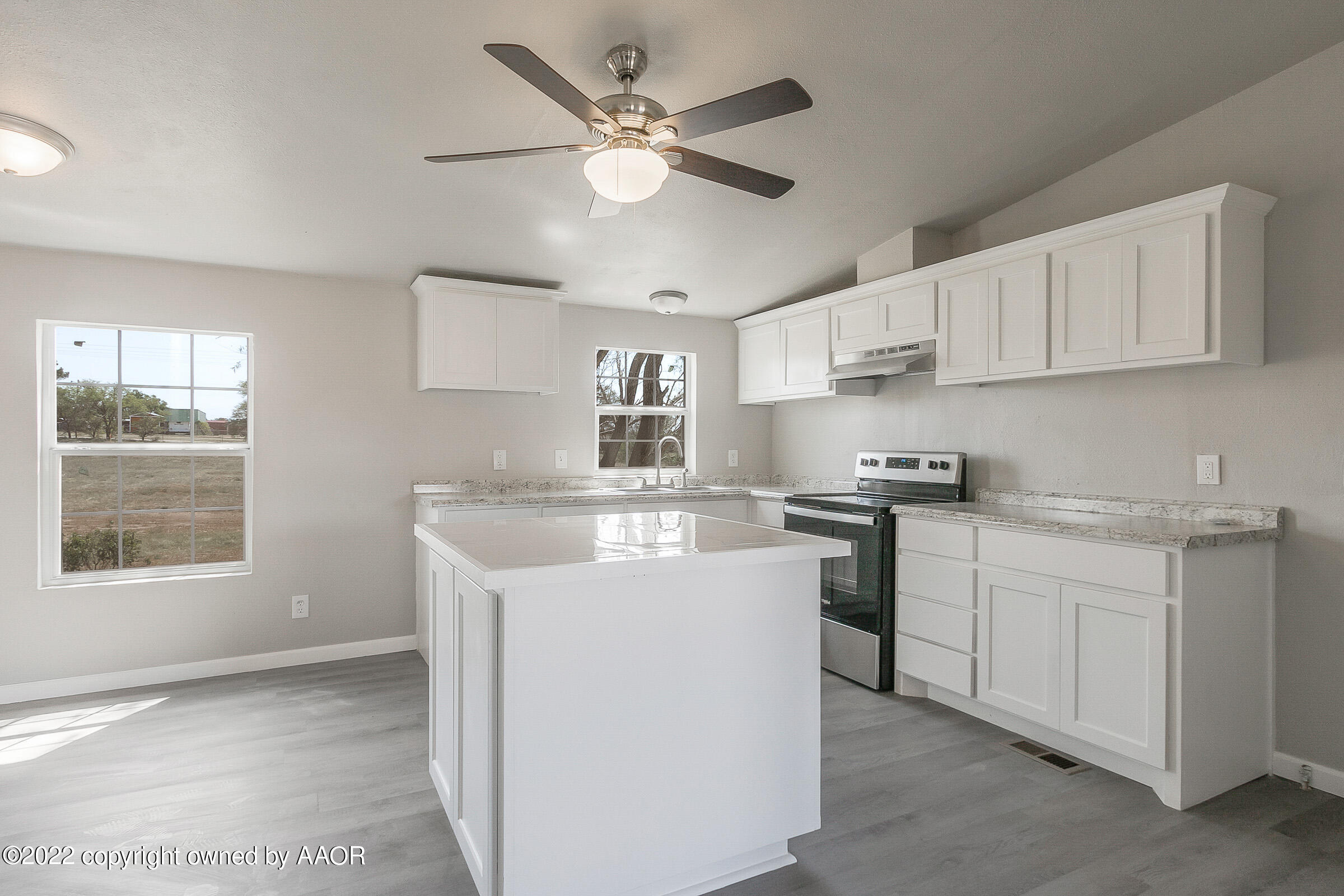 3501 Silver Hill Circle Amarillo, TX 79108 - Photo 8 of 25 a kitchen with stainless steel appliances granite countertop a sink a stove a refrigerator cabinets and a window