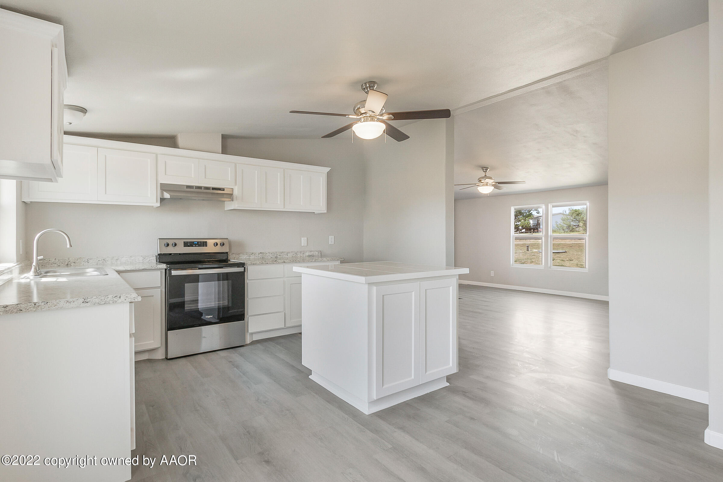 3501 Silver Hill Circle Amarillo, TX 79108 - Photo 9 of 25 a kitchen with granite countertop a stove a sink and a refrigerator