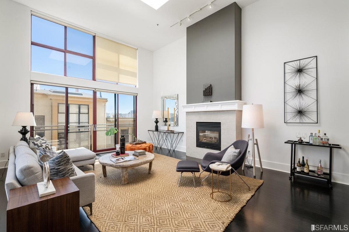 638 Minna, Unit 7 San Francisco, CA 94103 - Photo 1 of 57 a living room with furniture fireplace and a large window