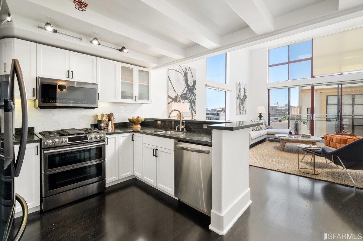 638 Minna, Unit 7 San Francisco, CA 94103 - Photo 22 of 57 a kitchen with stainless steel appliances granite countertop a stove and a sink