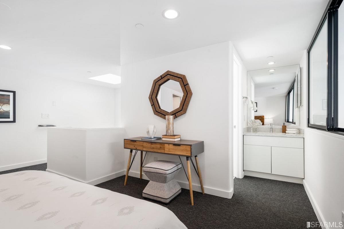 638 Minna, Unit 7 San Francisco, CA 94103 - Photo 46 of 57 a bedroom with a bed a mirror and a window