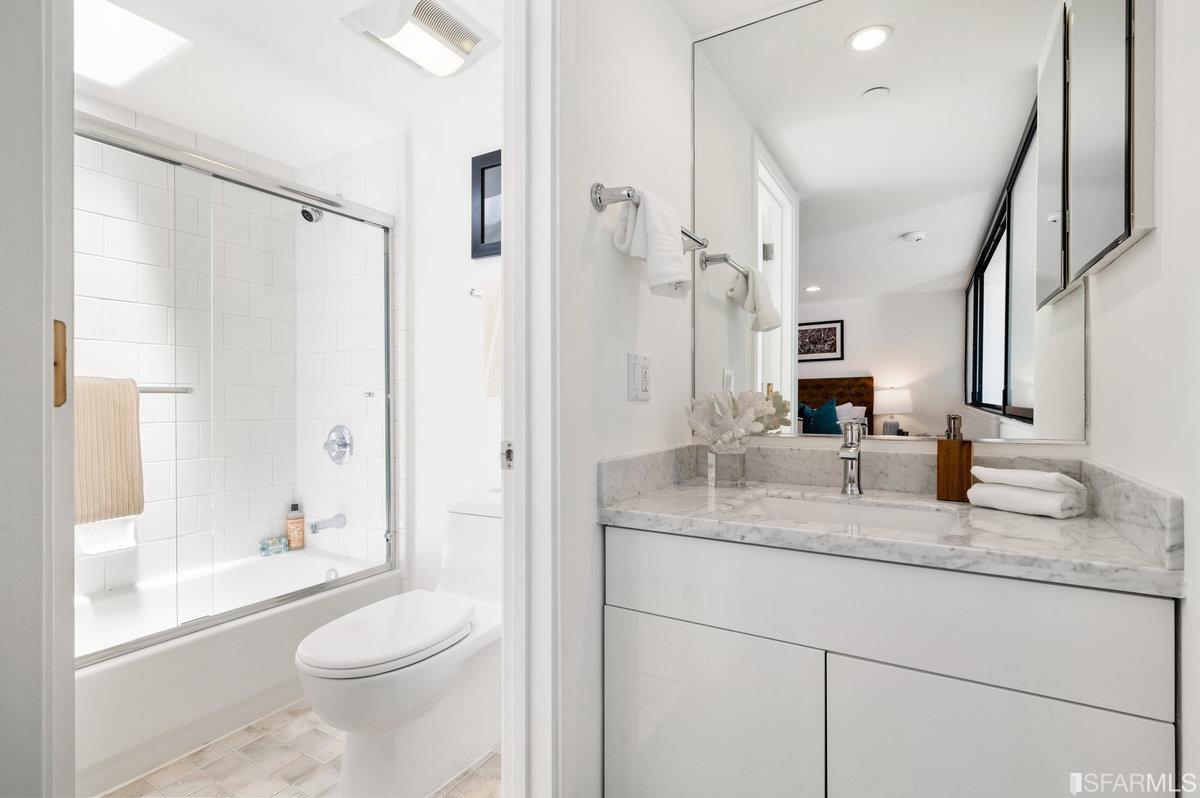 638 Minna, Unit 7 San Francisco, CA 94103 - Photo 47 of 57 a bathroom with a granite countertop sink toilet and shower