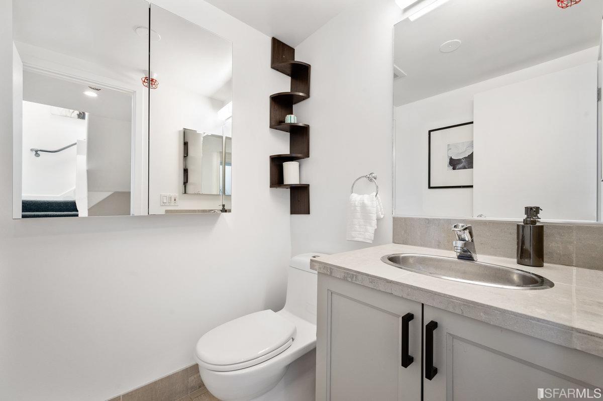 638 Minna, Unit 7 San Francisco, CA 94103 - Photo 51 of 57 a bathroom with a toilet sink and mirror