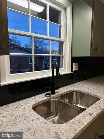 a kitchen with a sink and a window