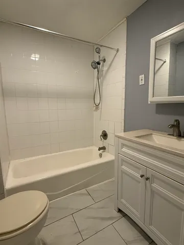 a bathroom with a sink a toilet and a bathtub