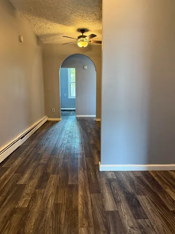 a view of entryway with wooden floor