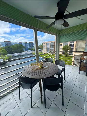 a view of a patio with a table chairs and a table
