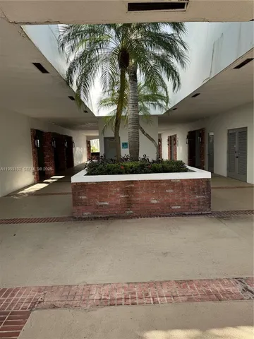 a view of a house with a yard and garage