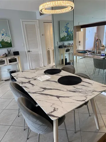 a kitchen with a sink a stove and a wooden floor