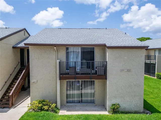 a view of a patio with a table and chairs