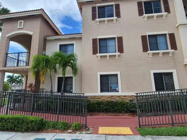 a view of a house with a swimming pool and a yard